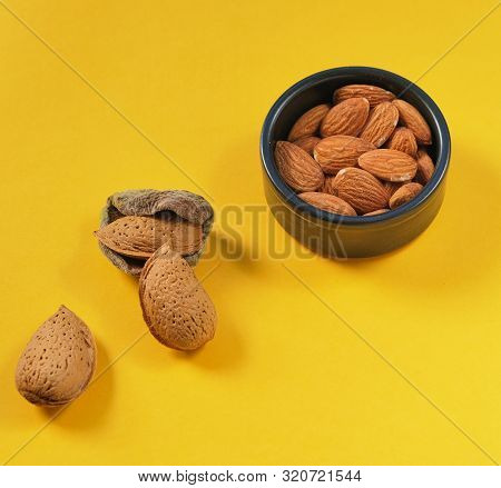 Almonds Evolution From The Fruit To The Shelled Nuts. Kernel In The Bowl And Almonds In Their Skins 