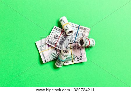 Stacks Of One Hundred Dollars Banknotes Close-up On Colored Background Business Concept Top View Wit
