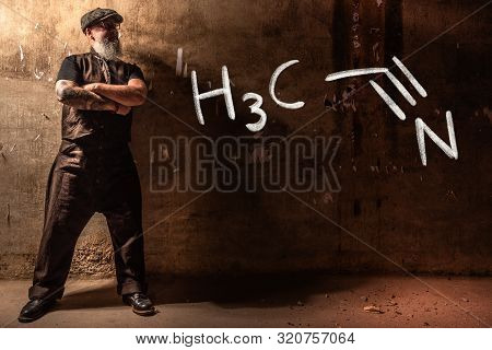 Bearded Old Man Presenting Handdrawn Chemical Formula Of Acetonitrile