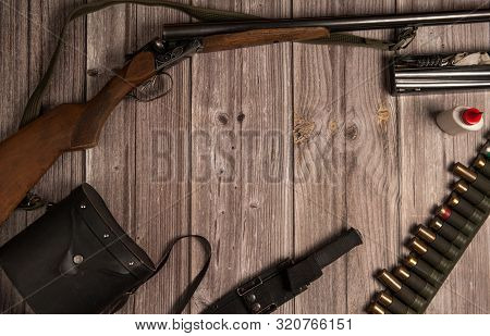 Hunting Theme. The Frame Is Made Of Hunting Weapons, A Bandoleer With Cartridges, Binoculars In A Ca