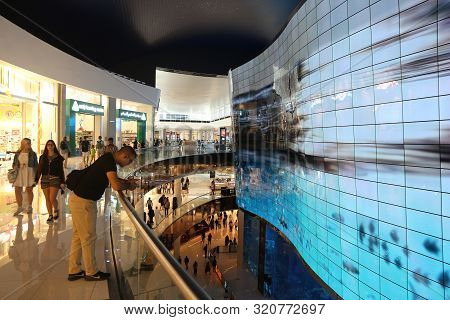 Dubai, Uae - November 22, 2017: Shoppers Visit Dubai Mall. It Is The Largest Mall In The World By To