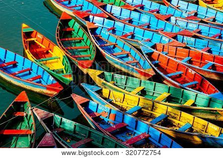 Colorful Rowboats On Lake