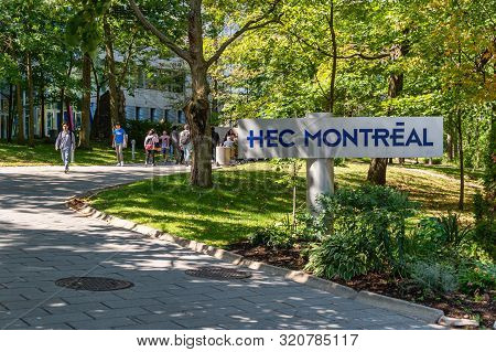 Montreal, Ca - 5 September 2019: Students Passing By Hec Montreal Sign
