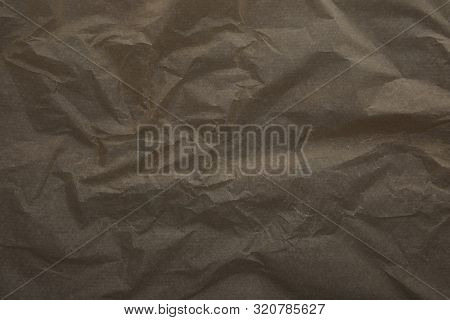 Top View Of Dark Beige Crumped Parchment Paper Surface With Copy Space
