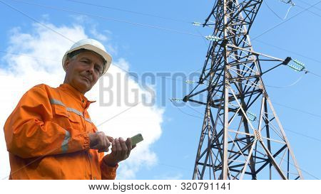 Explorer Types On Smartphone Under Blue Sky With Cloud