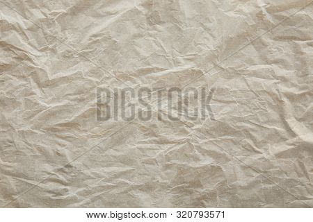 Top View Of Beige Crumped Parchment Paper Surface With Copy Space