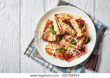 Meat And Mushrooms Stuffed Crepes Crisped Up In Butter, Krokiety Z Miesem, Polish Cuisine, Served On