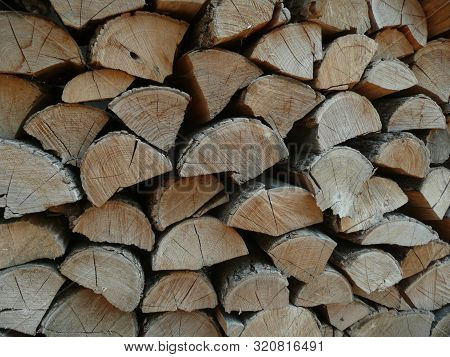 chopped firewood and stacked neatly in a pile.