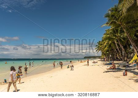 Balabag, Boracay Island, Philippines - March 4, 2019: White Beach Shows Sand And Azure Sea With Wall