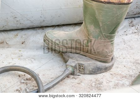 Pump In The Boat. Swing A Rubber Boat With Your Foot. A Man Shakes A Boat. To Go Fishing. Rubber Boo