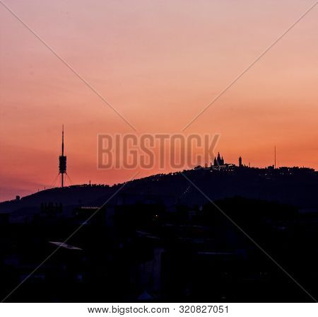 Tibidabo Mountain Silhouette, With The Church And Communications Antenna Of Collserola. Sunset In Th