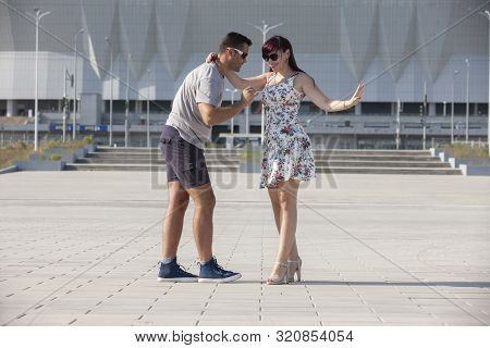 Young Couple Dances Caribbean Salsa. Social Activity Concept.