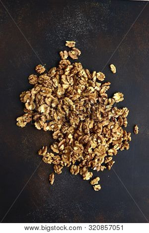 Heap Of Raw Peelled Organic Walnuts. Top View With Copy Space.