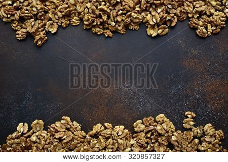 Heap Of Raw Peelled Organic Walnuts. Top View With Copy Space.