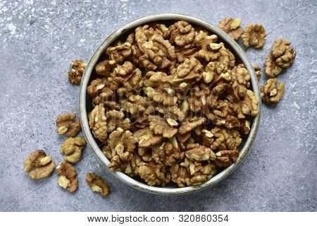 Bowl Of Peelled Walnuts. Top View With Copy Space.