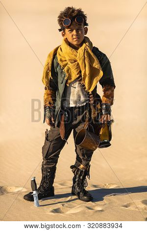 Post-apocalyptic Boy Outdoors In The Desert. Nuclear Post-apocalypse. Life After Doomsday Concept. D