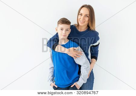 Parenting, Family And Single Parent Concept - A Happy Mother And Teen Son Laughing And Embracing On 