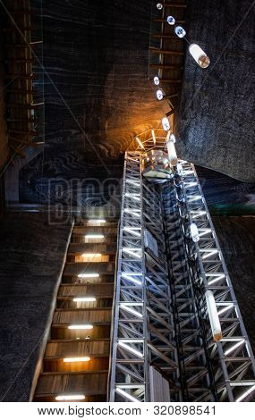 TURDA, ROMANIA - AUG 15, 2019: Turda Salt Mine or Salina Turda, well known landmark in Transylvania with an underground museum and theme park, Romania, Europe