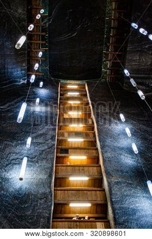 TURDA, ROMANIA - AUG 15, 2019: Turda Salt Mine or Salina Turda, well known landmark in Transylvania with an underground museum and theme park, Romania, Europe