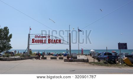 Sauble Beach, Ontario / Canada -  August 05, 2019:  Sauble Beach tourist destination, Bruce Peninsula attraction along the eastern shore of Lake Huron, Sable beach entrance gate