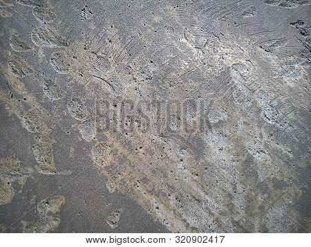 Roughly Machined Metal Surface With Craters And Scratches