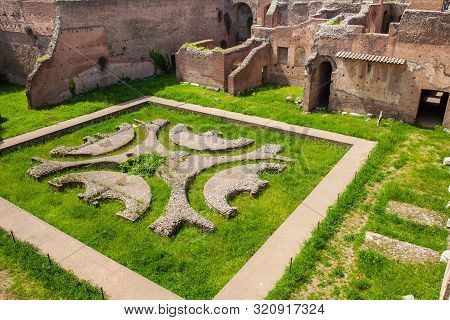 Courtyard Garden Of The Ancient Ruins Of The Domus Augustana On Palatine Hill In Rome