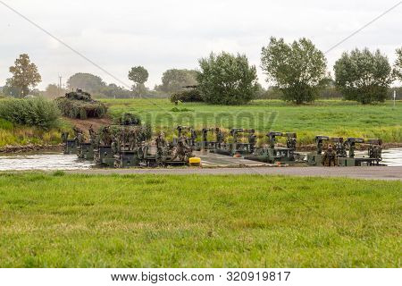 Minden / Germany - September 4, 2019: Panzerpionierbattaillon Trained A Tank Crossing Over A River W