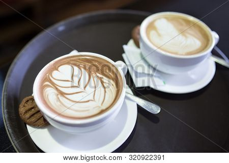 Cup Of Latte Art Or Cappuccino Latte Art Pouring Steamed Milk Foam.