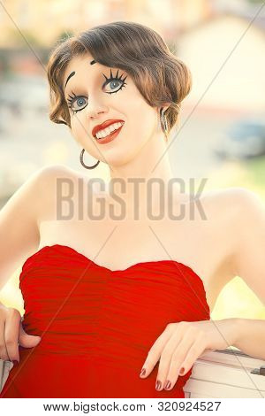 Fun Young Woman With Vintage Pinup Makeup Making Dolly Face Looking At Camera