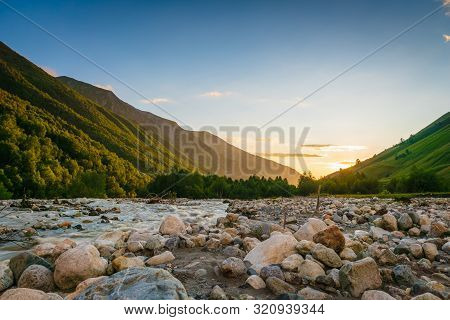 Svaneti Landscape At Sunset With Mountains And River On The Trekking And Hiking Route Near Mestia Vi