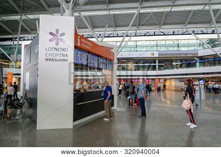 Warsaw, Poland - July 2019: Warsaw Chopin Airport Architecture And Passengers Inside. Warsaw Chopin 