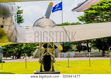 Cheonan, South Korea; August 8, 2019: Rear View Of Right Wing, Engine Cowling And Landing Gear Of De