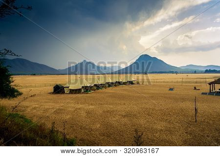 Swiss Tents In The Sand Surrounded By Eastern Ghat Mountain Range With Copy Space
