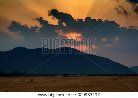 Sun Settin Behind Eastern Ghat Mountain Range Over Mahanadi River, Copy Space