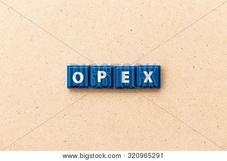 Tile Letter In Word Opex (abbreviation Of Operating Expense) On Wood Background