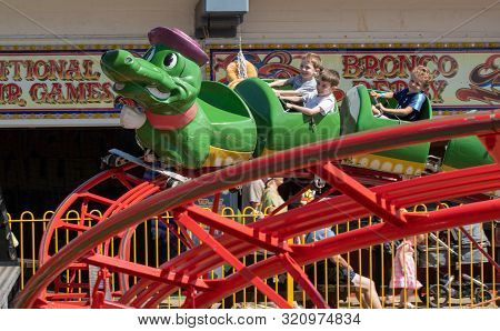 Clacton   United Kingdom 23 August  2019  -:  Young Children Enjoying Green Caterpillar Fairground R