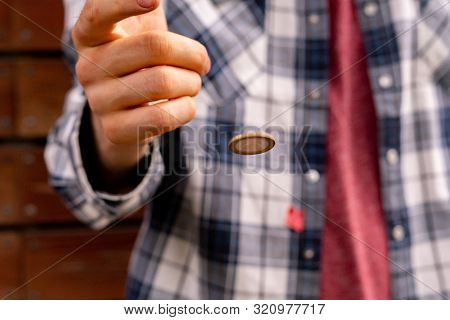 Close Up Shot Of Hand Toss A Coin, Probable And Winning Chances Concept, Fifty-fifty S