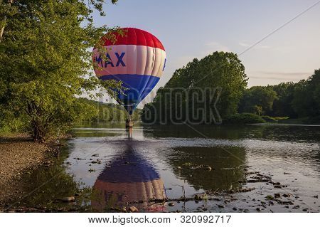 Festival Goers Watch Hot Air Balloons Take To Flight Early Saturday Morning, August 3, 2019 At The S