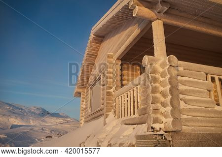 Icicles And Snow On A Window In A Rustic House. Concept Photo For Those Really Cold Winter Days.