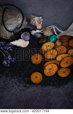 Homemade Wooden Runes On A Dark Background