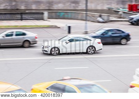Mercedes E-class Coupe C238 On The City Road. Fast Moving Car On Moscow Streets. Vehicle Driving Alo
