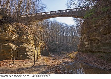 Concrete Trail Bridge Over A Sandstone Canyon In Matthiessen State Park In Illinois