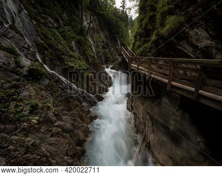 Nature Landscape Panorama Of Wooden Boardwalk Path In Raw Wild Mountain Stream River Gorge Ravine Wi