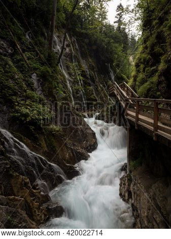 Nature Landscape Panorama Of Wooden Boardwalk Path In Raw Wild Mountain Stream River Gorge Ravine Wi