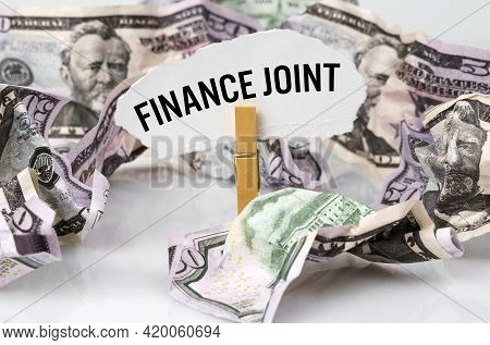 Business And Finance Concept. There Are Dollars On The Table And There Is A Clothespin With Paper On