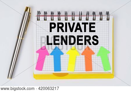 Business And Finance Concept. On A White Background Lie A Pen And A Notebook With The Inscription - 