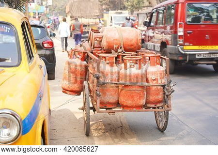 February 2021, Kolkata, India. Indane Lpg Cylinders Being Carried Together On The Road During Day Ti