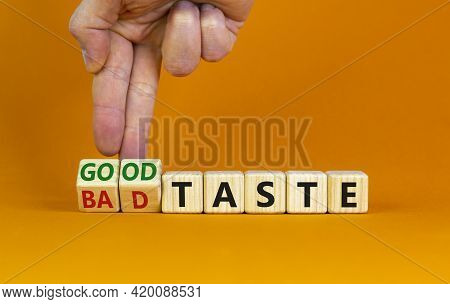 Good Or Bad Taste Symbol. Businessman Turns Wooden Cubes And Changes Words 'bad Taste' To 'good Tast