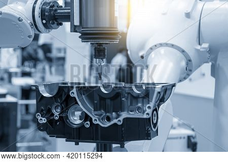 The Automotive Parts Finishing Process By Milling Process Attached The Robotics Arm. The Hi-technolo