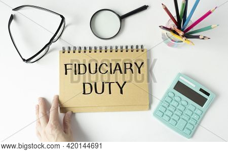Paper With Text Fiduciary Duty On Wood Table.